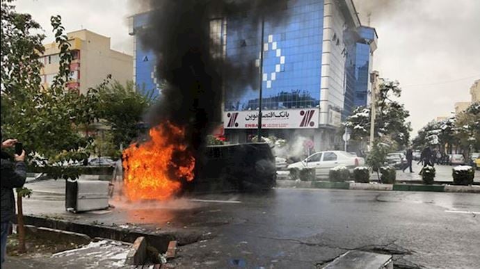 Police car burned down in Iranian uprising in 2019