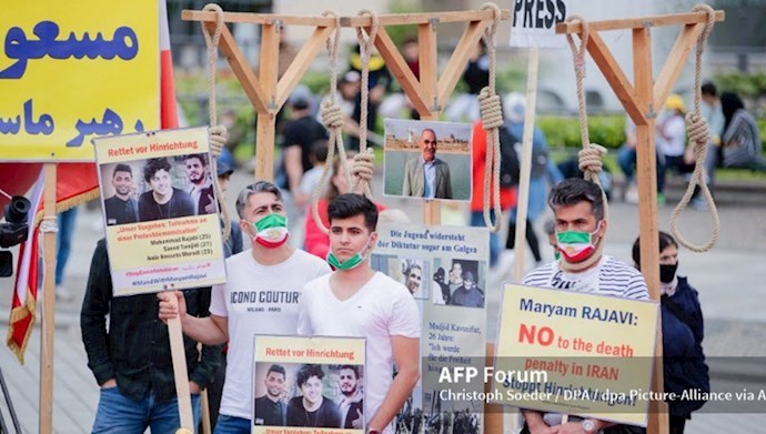 Berlin-–-Iranians-in-exile-rallying-in-condemnation-of-the-death-sentences-issued-for-three-young-Iranian-protesters