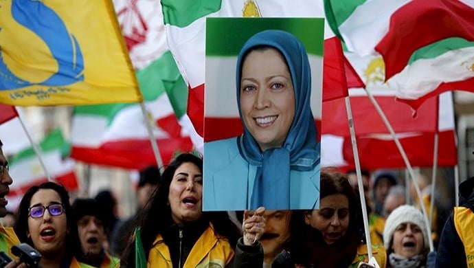 Young-female-supporters-of-the-Iranian-Resistance-hold-pictures-of-NCRI’s-President-elect-Maryam-Rajavi-in-a-demonstration-in-London.