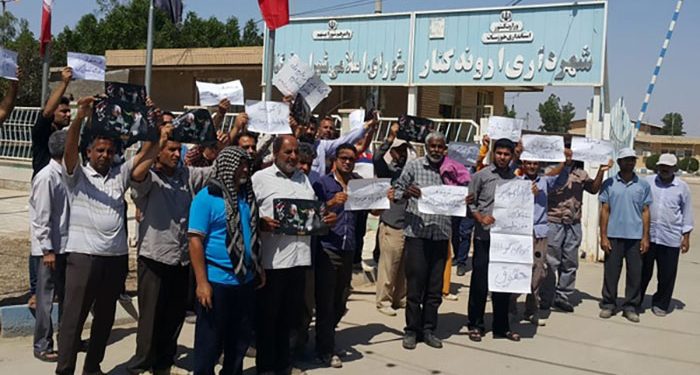 The municipal workers in the city of Arvand Kenar, hold a protest