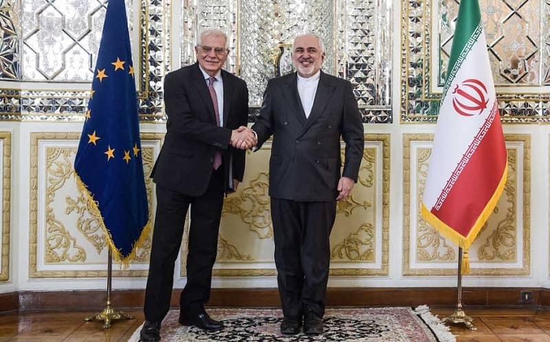 Josep Borrell shakes hands with Javad Zarif in Tehran