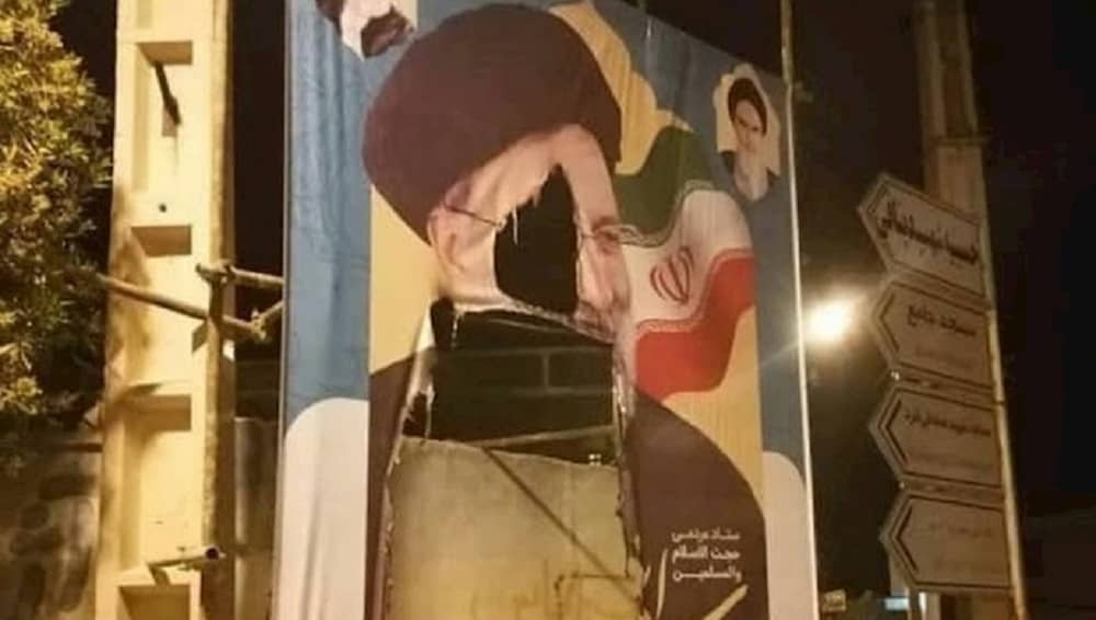 iran-presidential-elections-ebrahim-raisi-banner-ripped 