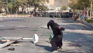iran-uprising-local-throwing-stone-1