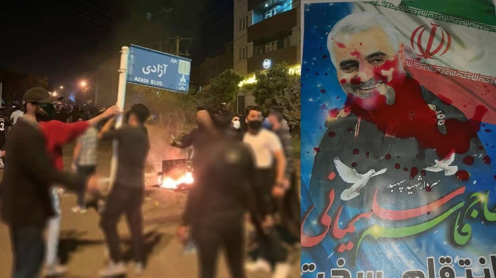 iran-uprising-street-damaging-board-soleimani-poster