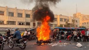 iran uprising botorbyke burned