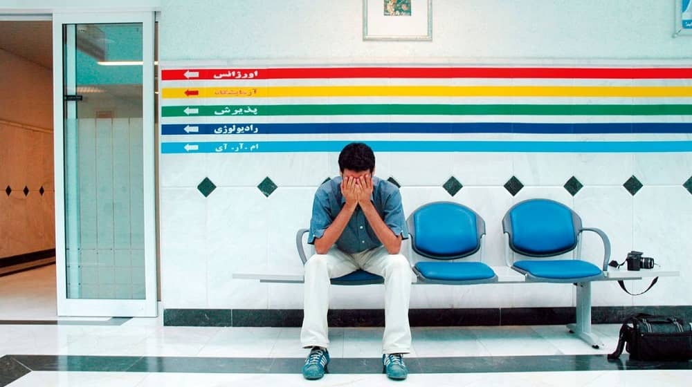 iran hospital sad man facepalm (1)