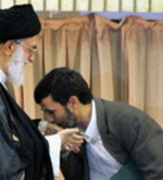Ahmadinejad kissing Khameini's hand