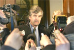 French representative Stanislav Laboulaye briefs the media after talks with representatives of Iran in front of Iran's embassy in Vienna December 21, 2005. (Herwig Prammer/Reuters) 