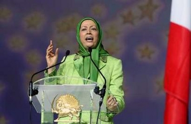 Maryam Rajavi delivers a speech at a meeting after a Paris