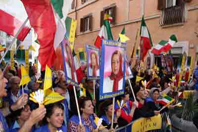 A cheering crowd welcomes Maryam Rajavi as she arrives in Italian parliament 