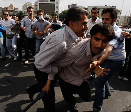 Angry Iranians disarm a plain cloth agent of regime during Tehran unrest - June 15, 2009