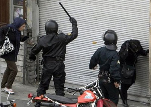  Iranian regime's State Security Forces on motorcycles surround anti-regime protesters during clashes in Tehran.