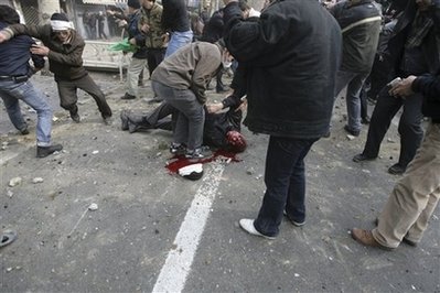 The dead body of a man who allegedly was shot during anti-government protest at the Enqelab (Revolution) St. in Tehran, Iran, Sunday, Dec. 27, 2009