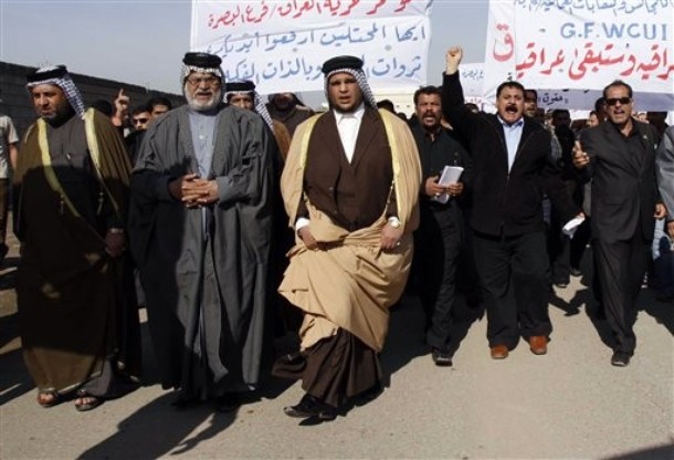 Iraqi demonstrators chant slogans against Iranian regime to protest the Iranian regime's seizure of the al-Fakka oil field in front of the Iranian regime's embassy in Basra, Iraq, Saturday, Jan. 2, 2010.