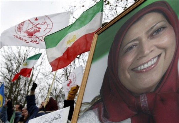 Protestors rally alongside a poster of Maryam Rajavi, head of the National Council of Resistance of Iran outside the Iranian embassy in London, Thursday, Dec. 31, 2009. Supporters of the People's Mujahedeen Organization of Iran rallied outside the Iranian embassy in solidarity with the uprising in Iran.
