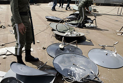 Iranian regime's State Security Forces (SSF) regularly ambush private houses rounding up satellite dishes from the rooftops and back yards.