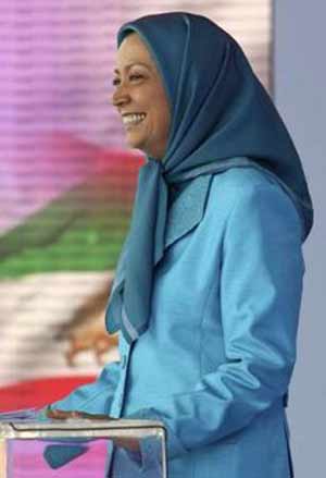 Maryam Rajavi waves the Iranian flag during a rally near Paris June 26