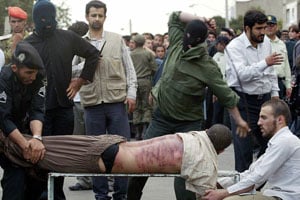 A man is being lashed in public in Iran, 2007