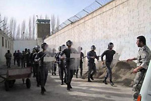 Anti-riot prison guards maneuvering in a prison in Iran