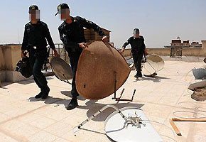 File photo: Police round up satellite dishes in Karaj