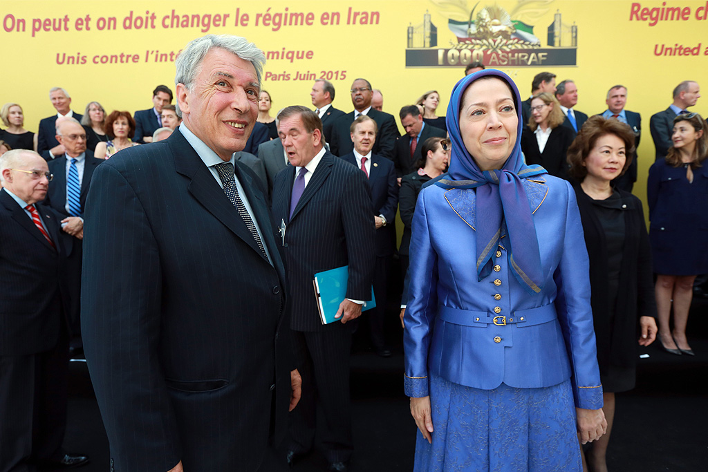 Gilbert Mitterrand, son of the late French President François Mitterrand and head of the human rights group France Libertés, stands alongside Maryam Rajavi, President-elect of the Iranian Resistance