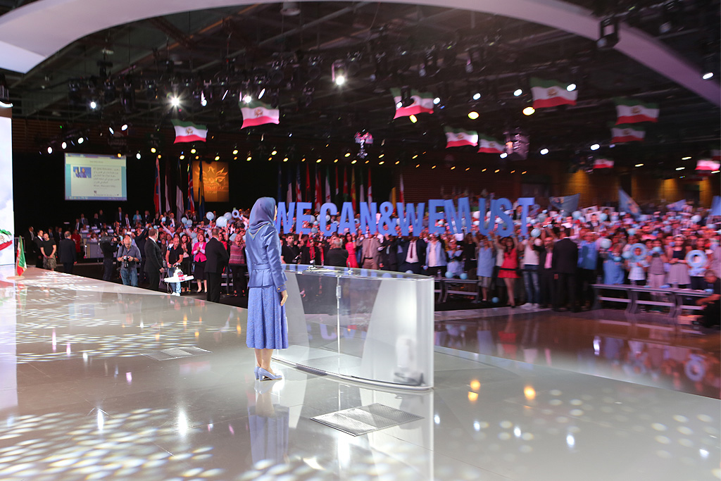 Top Iranian opposition leader Maryam Rajavi is cheered by supporters during mass rally for democratic change in Iran in Parc des Expositions exhibition center on June 13, 2015 in Villepinte